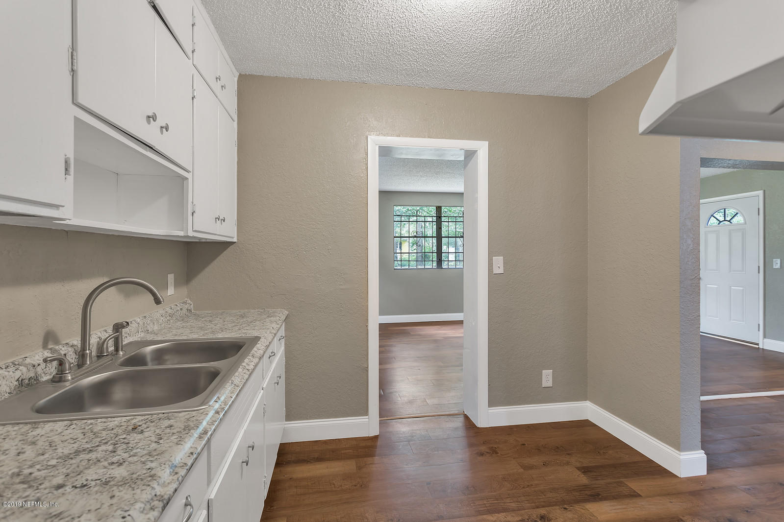 6718 Cavalier Road Jacksonville, FL 32208 - Photo 6 of 15 a kitchen with sink and cabinets