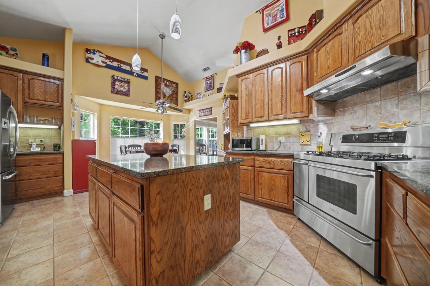 16111 Pioneer Creek Road Pioneer, CA 95666 - Photo 13 of 59 a kitchen with stainless steel appliances granite countertop a stove and a sink
