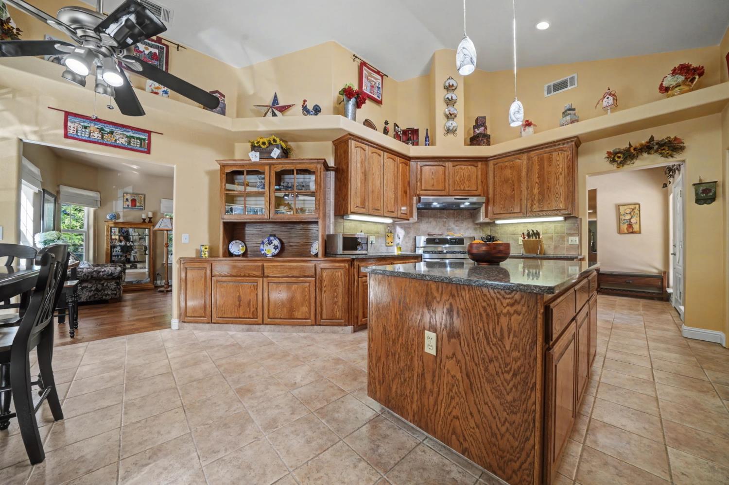 16111 Pioneer Creek Road Pioneer, CA 95666 - Photo 14 of 59 a kitchen with stainless steel appliances granite countertop a sink and cabinets