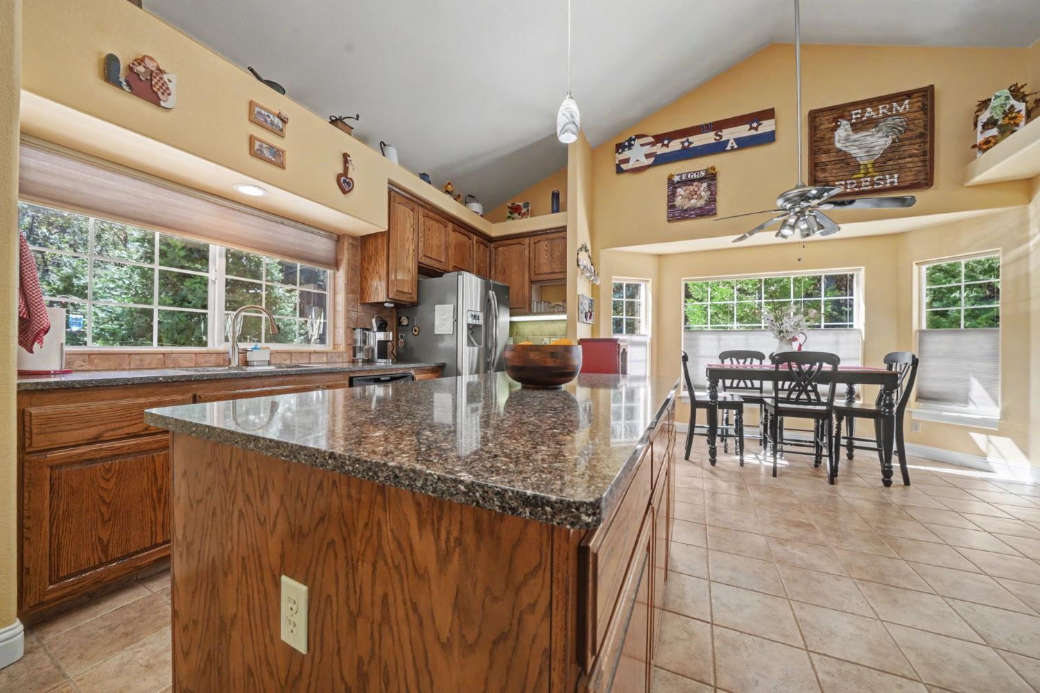 16111 Pioneer Creek Road Pioneer, CA 95666 - Photo 16 of 59 a kitchen with stainless steel appliances granite countertop a sink and a large window