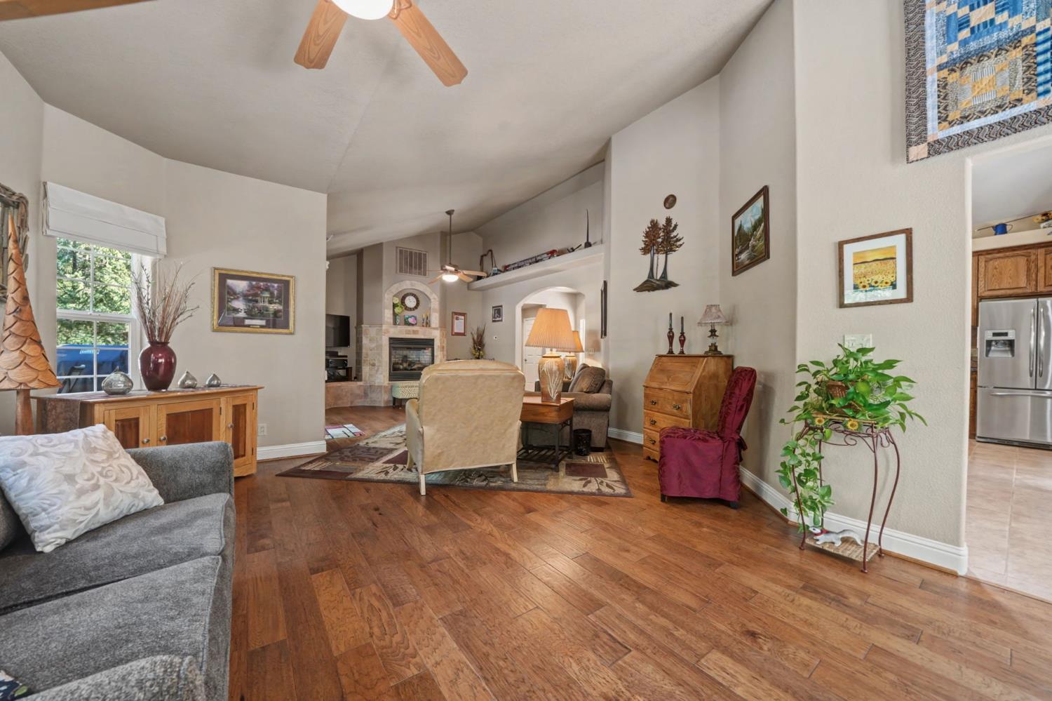 16111 Pioneer Creek Road Pioneer, CA 95666 - Photo 20 of 59 a living room with furniture floor to ceiling window and wooden floor