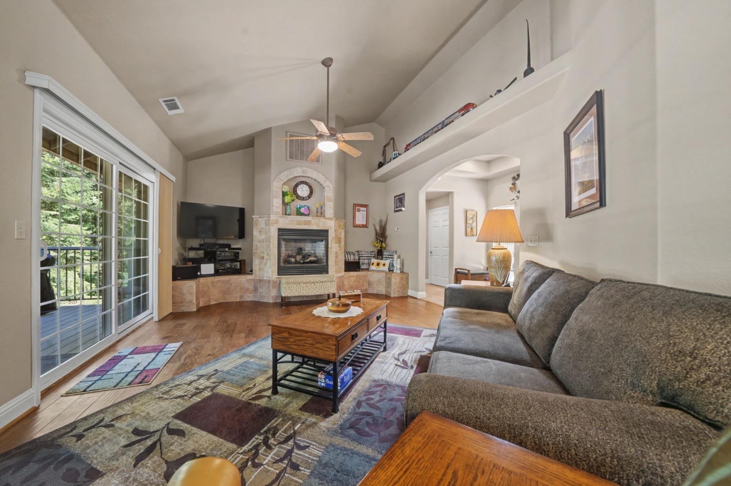 16111 Pioneer Creek Road Pioneer, CA 95666 - Photo 22 of 59 a living room with furniture fireplace and a large window