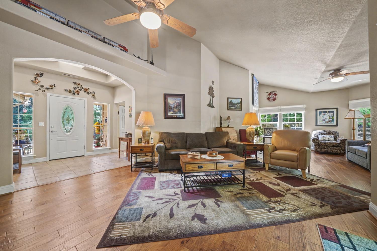 16111 Pioneer Creek Road Pioneer, CA 95666 - Photo 23 of 59 a living room with furniture rug and wooden floor