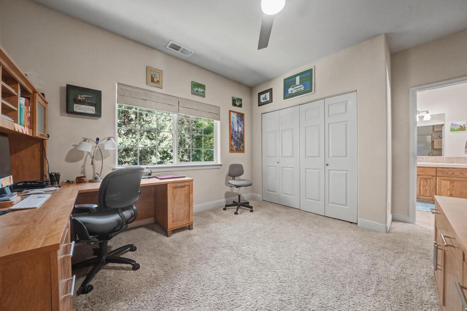 16111 Pioneer Creek Road Pioneer, CA 95666 - Photo 37 of 59 a view of a workspace with furniture and a window