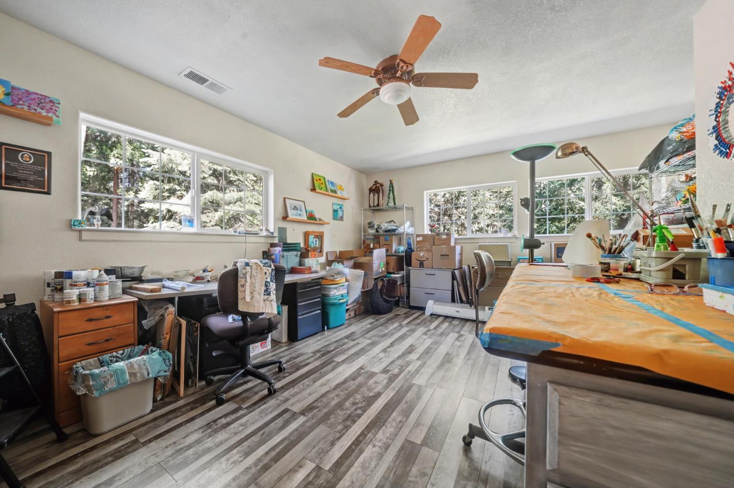 16111 Pioneer Creek Road Pioneer, CA 95666 - Photo 39 of 59 a bed room with furniture and a flat screen tv