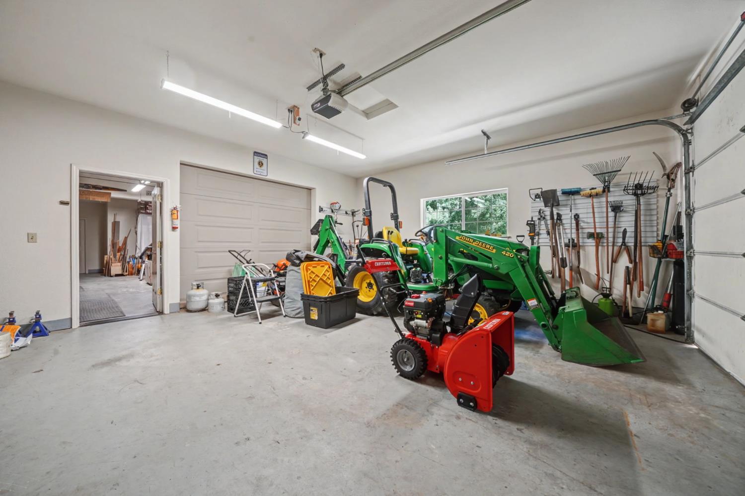 16111 Pioneer Creek Road Pioneer, CA 95666 - Photo 46 of 59 a view of a garage with a bike and white door