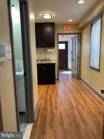 a en suite bathroom with a sink and mirror