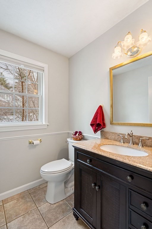 13 Jonathans Way Upton, MA 01568 - Photo 15 of 36 a bathroom with a sink vanity mirror and toilet