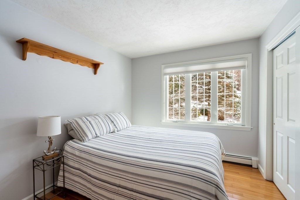 13 Jonathans Way Upton, MA 01568 - Photo 20 of 36 a bedroom with a bed and a window