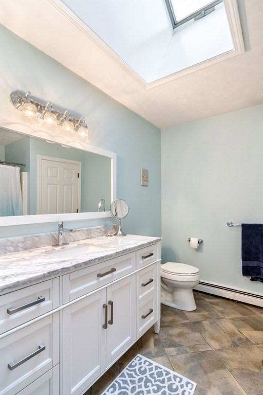 13 Jonathans Way Upton, MA 01568 - Photo 21 of 36 a bathroom with a granite countertop toilet sink and mirror
