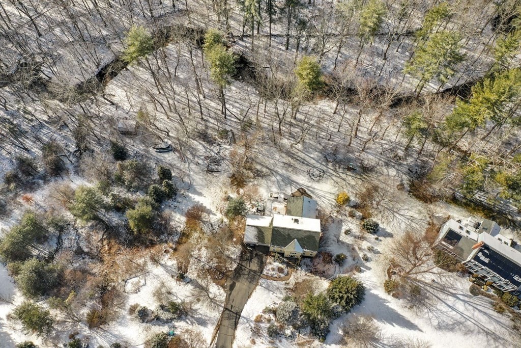 13 Jonathans Way Upton, MA 01568 - Photo 30 of 36 a backyard of a house with a yard and outdoor seating
