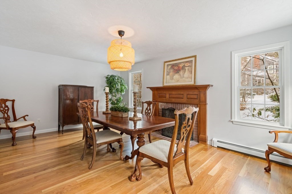13 Jonathans Way Upton, MA 01568 - Photo 3 of 36 a view of a dining room with furniture and wooden floor