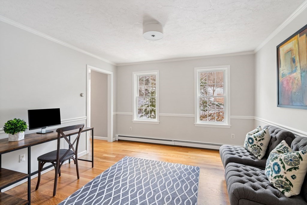 13 Jonathans Way Upton, MA 01568 - Photo 5 of 36 a living room with furniture and a flat screen tv