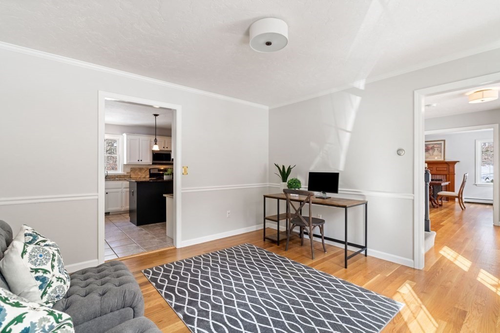 13 Jonathans Way Upton, MA 01568 - Photo 6 of 36 a living room with furniture and a table