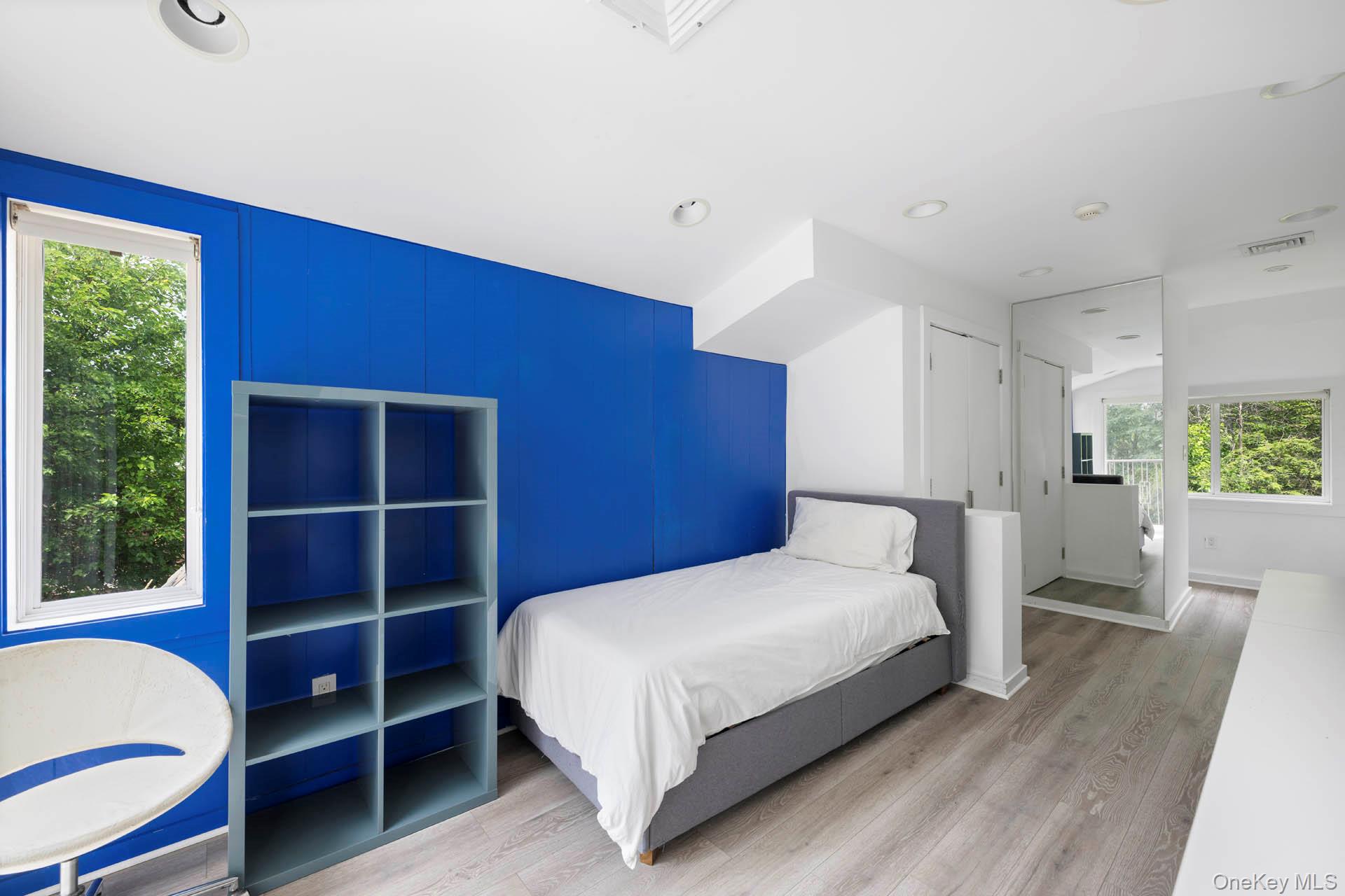 800 West 231st Street Bronx, NY 10463 - Photo 22 of 36 a bedroom with a bed and a window