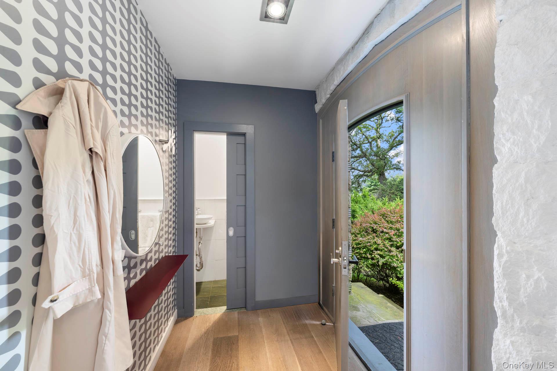 800 West 231st Street Bronx, NY 10463 - Photo 8 of 36 a view of a bedroom with wooden floor and windows