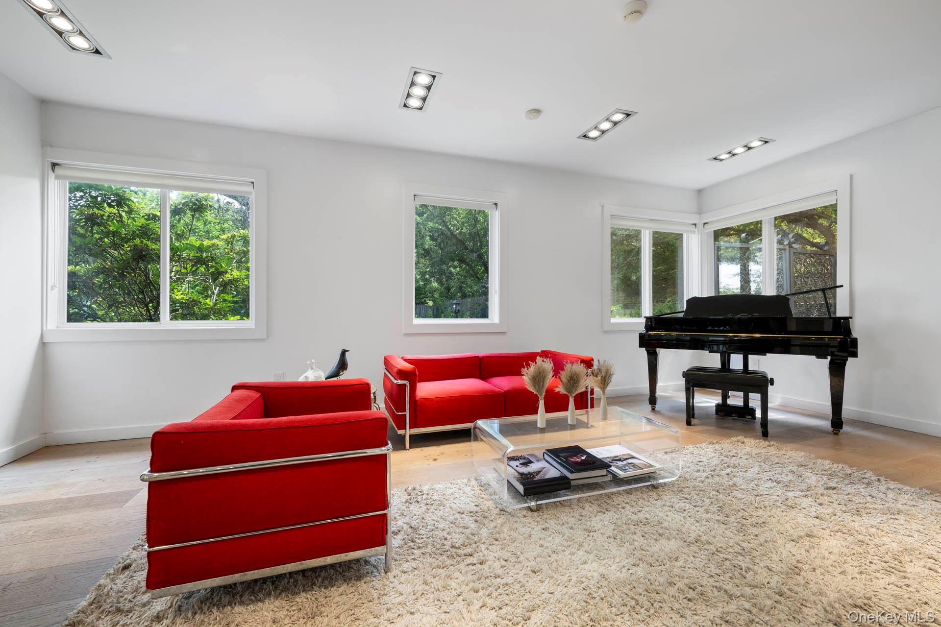 800 West 231st Street Bronx, NY 10463 - Photo 9 of 36 a living room with furniture and a window
