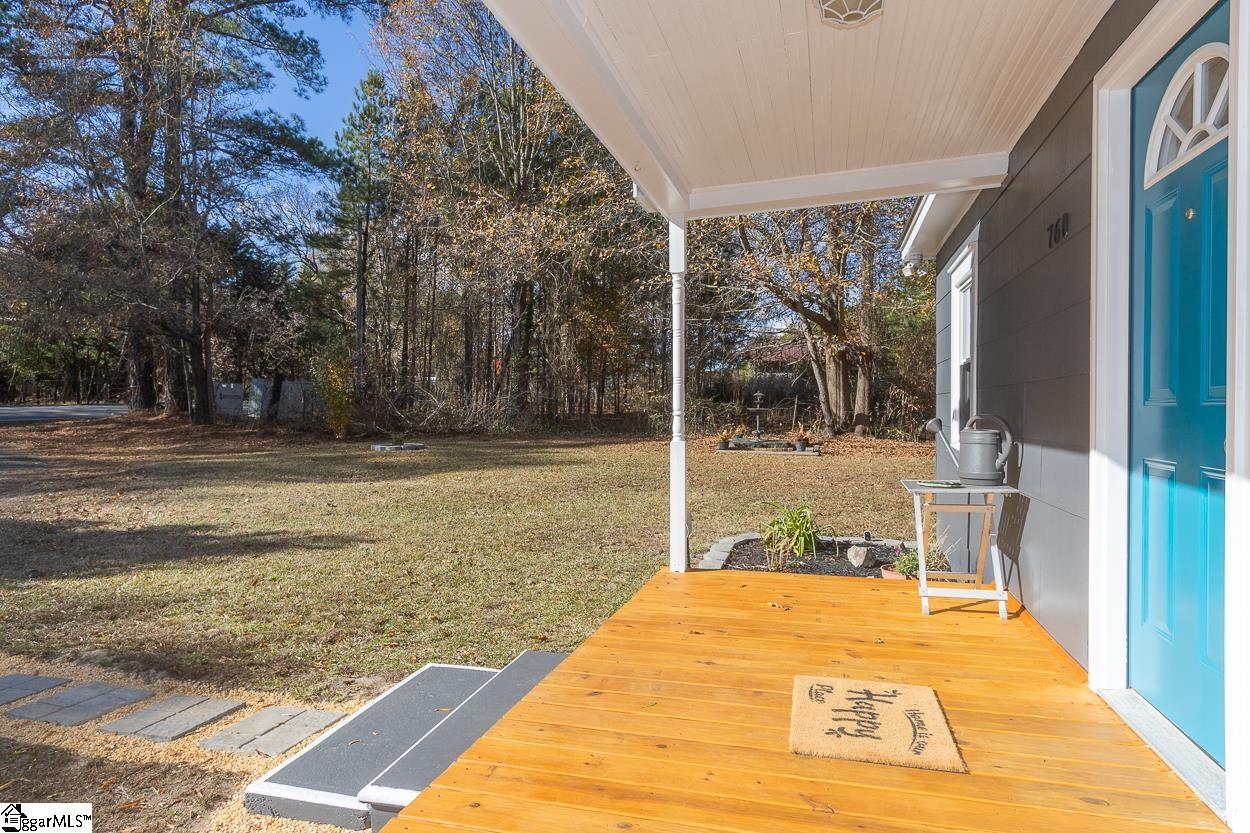 760 Cherokee Road Pelzer, SC 29669 - Photo 5 of 36 The new front porch welcomes you to your peaceful retreat moments away from the convenience of city access! This charming 3-bedroom, 1-bathroom home is nestled on a spacious over-acre lot, providing ample room to grow.