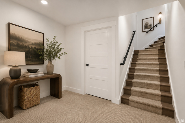 692 East Mountain Road North Ogden, UT 84414 - Photo 26 of 35 Carpeted staircase with dark wood treads and a black metal handrail