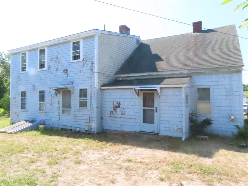 268 Main Street Dennis, MA 02660 - Photo 2 of 21 a front view of a house with a yard
