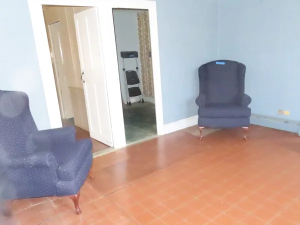 a view of furniture and wooden floor