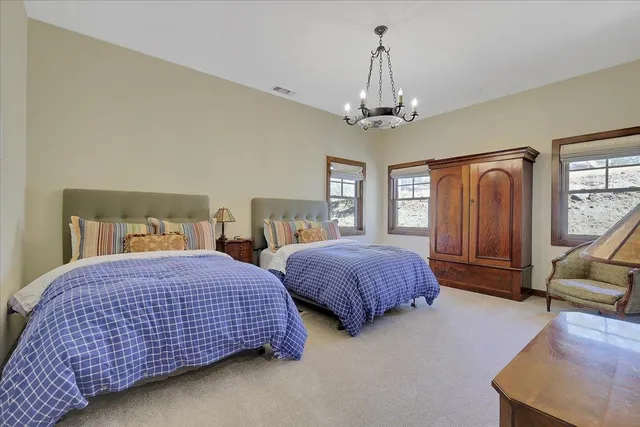 a living room with furniture a ceiling fan and a rug