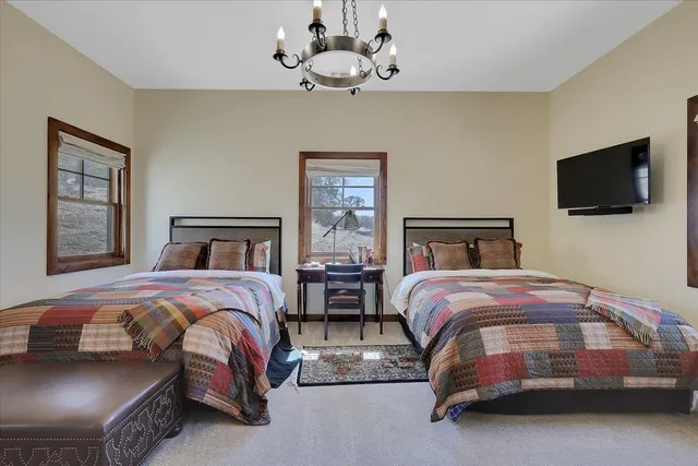 a bathroom with a granite countertop sink a mirror and a shower