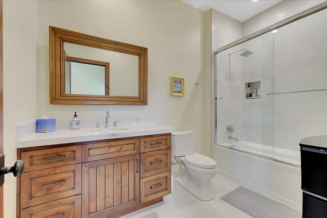 a en suite bathroom with a sink and a mirror