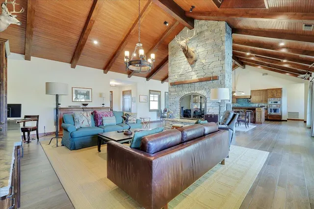 a living room with furniture and a rug