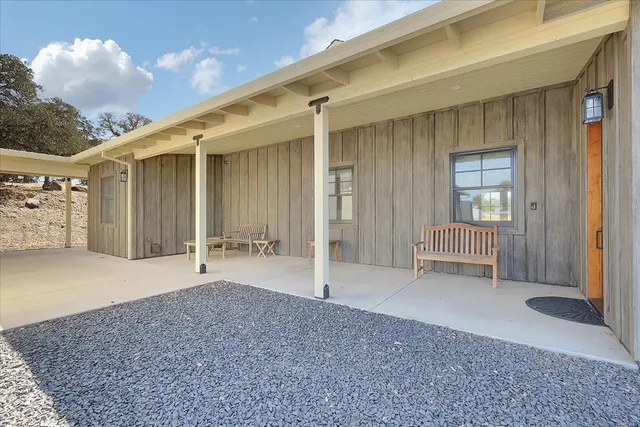 a view of a yard with snow on the road