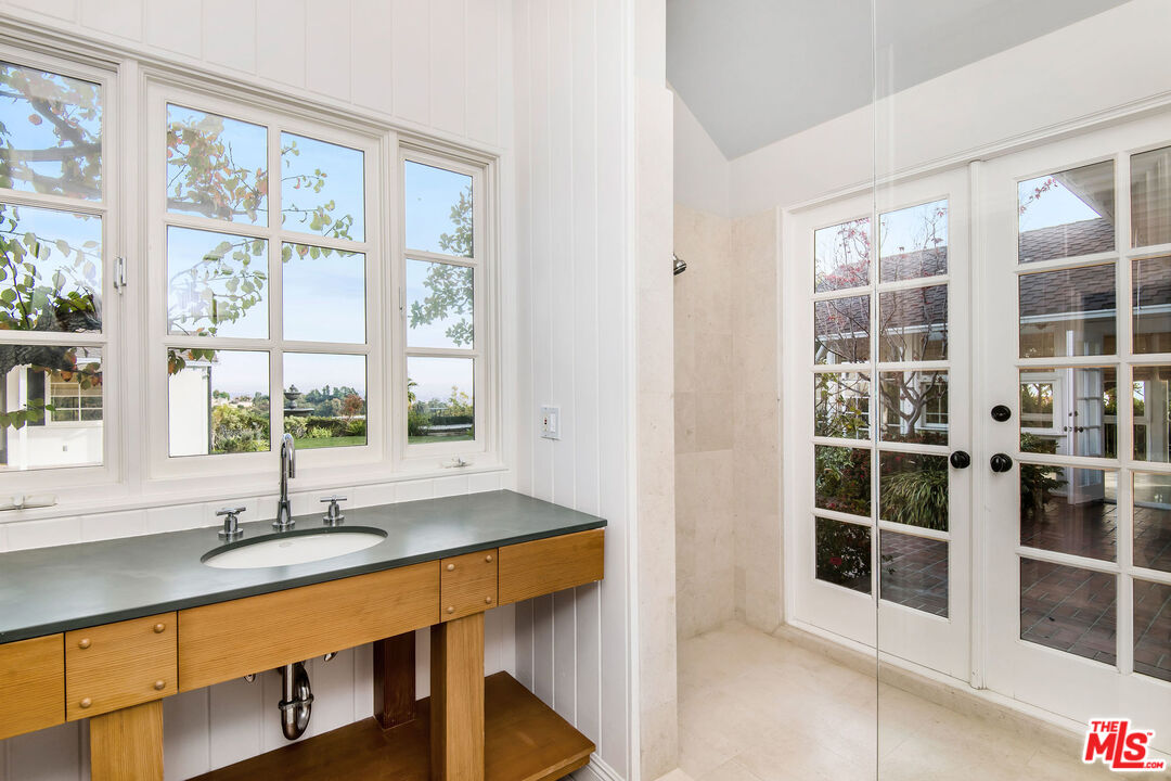 1110 Stradella Road Los Angeles, CA 90077 - Photo 14 of 26 a room with a large window and pool table