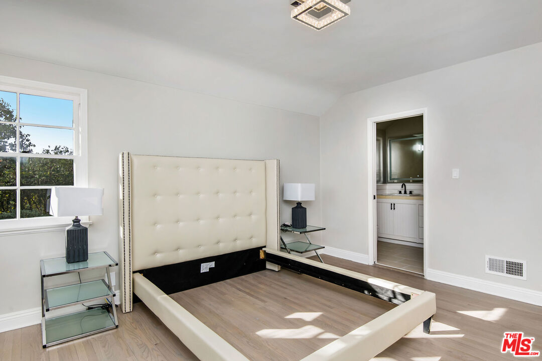 1110 Stradella Road Los Angeles, CA 90077 - Photo 15 of 26 a living room with a flat screen tv