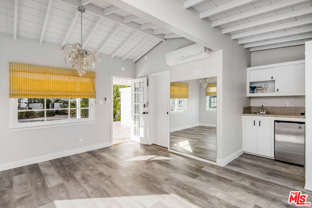 1110 Stradella Road Los Angeles, CA 90077 - Photo 20 of 26 a view of a kitchen with wooden floor and a kitchen