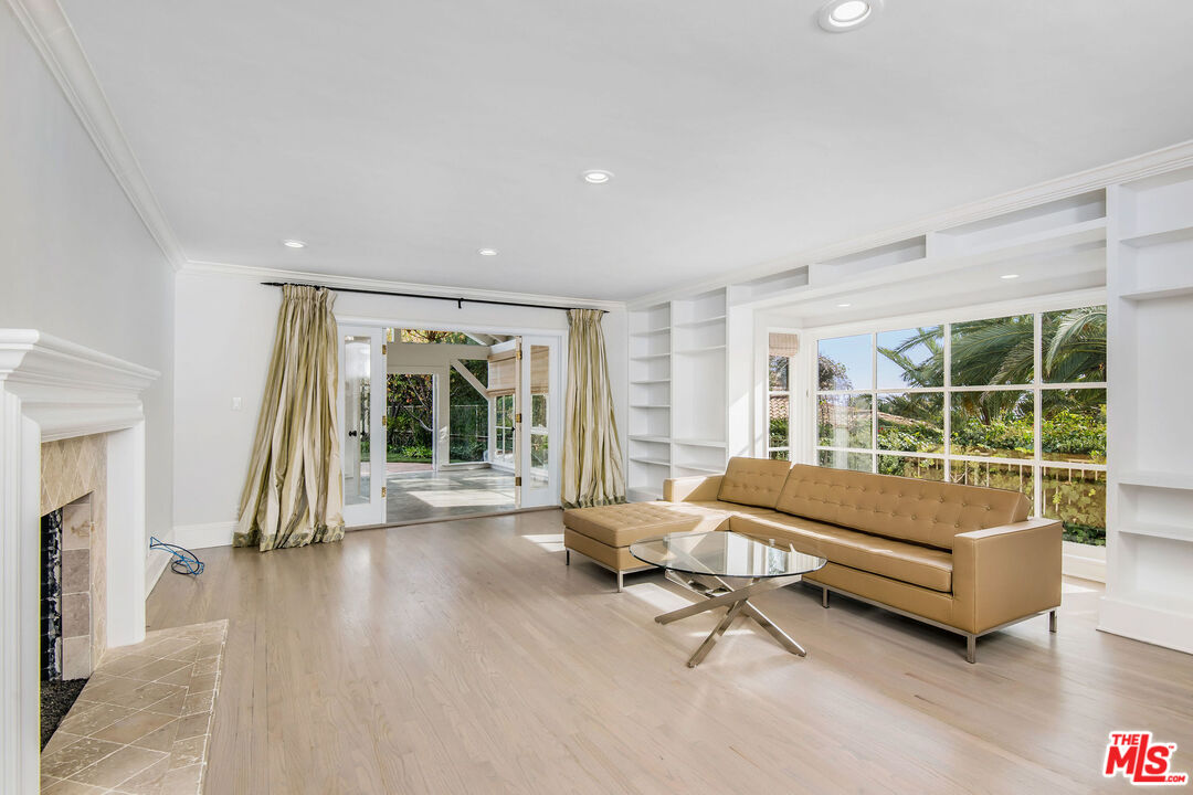 1110 Stradella Road Los Angeles, CA 90077 - Photo 8 of 26 a living room with furniture and a large window