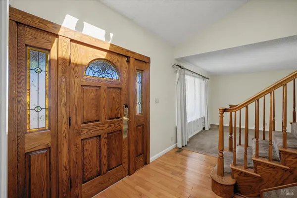 a view of an empty room with stairs
