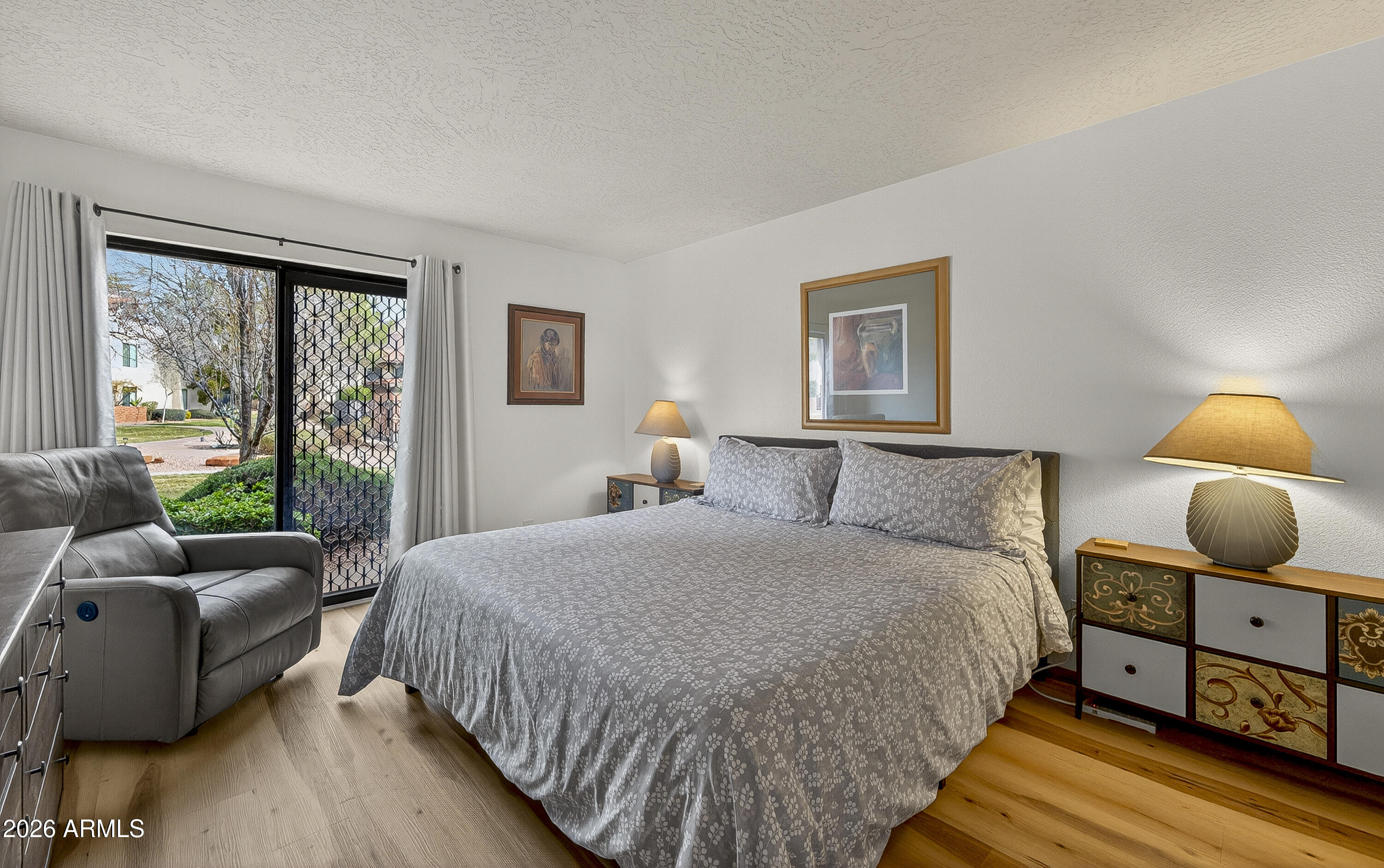 65 Verde Valley School Road, Unit E3 Sedona, AZ 86351 - Photo 12 of 24 a bedroom with a bed and window