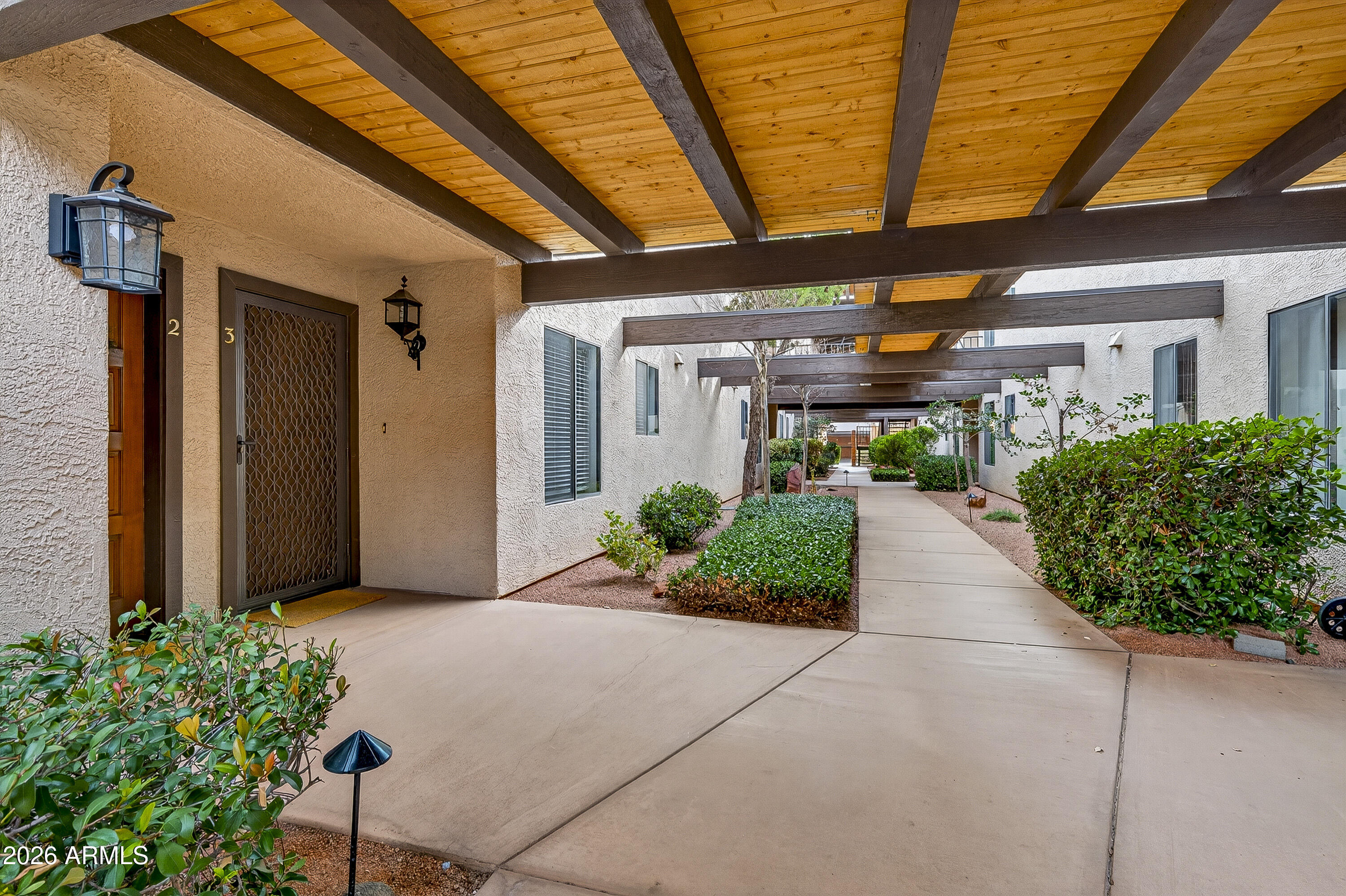 65 Verde Valley School Road, Unit E3 Sedona, AZ 86351 - Photo 3 of 24 a view of a patio with potted plants