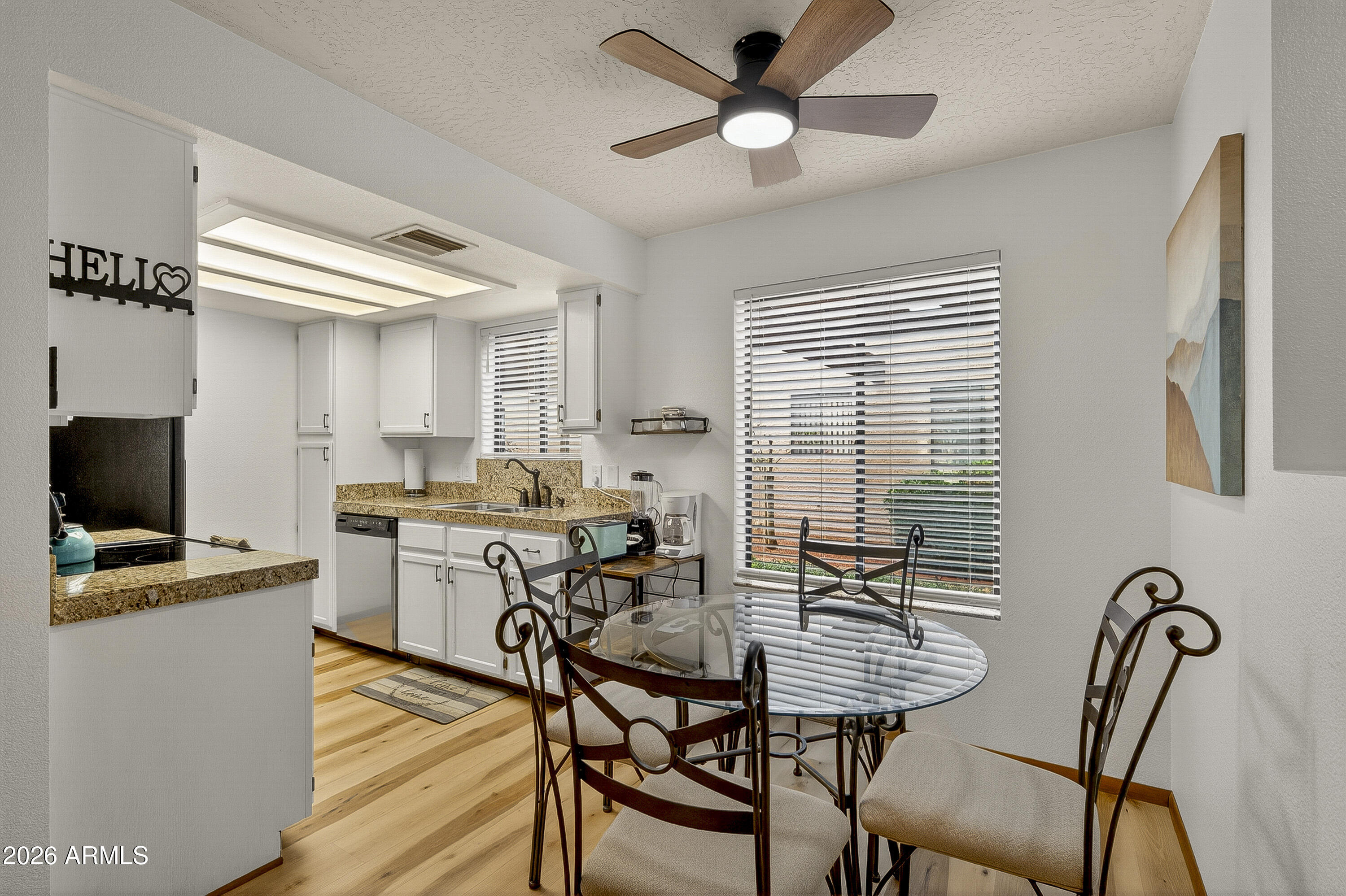 65 Verde Valley School Road, Unit E3 Sedona, AZ 86351 - Photo 7 of 24 a view of a dining room with furniture and a window