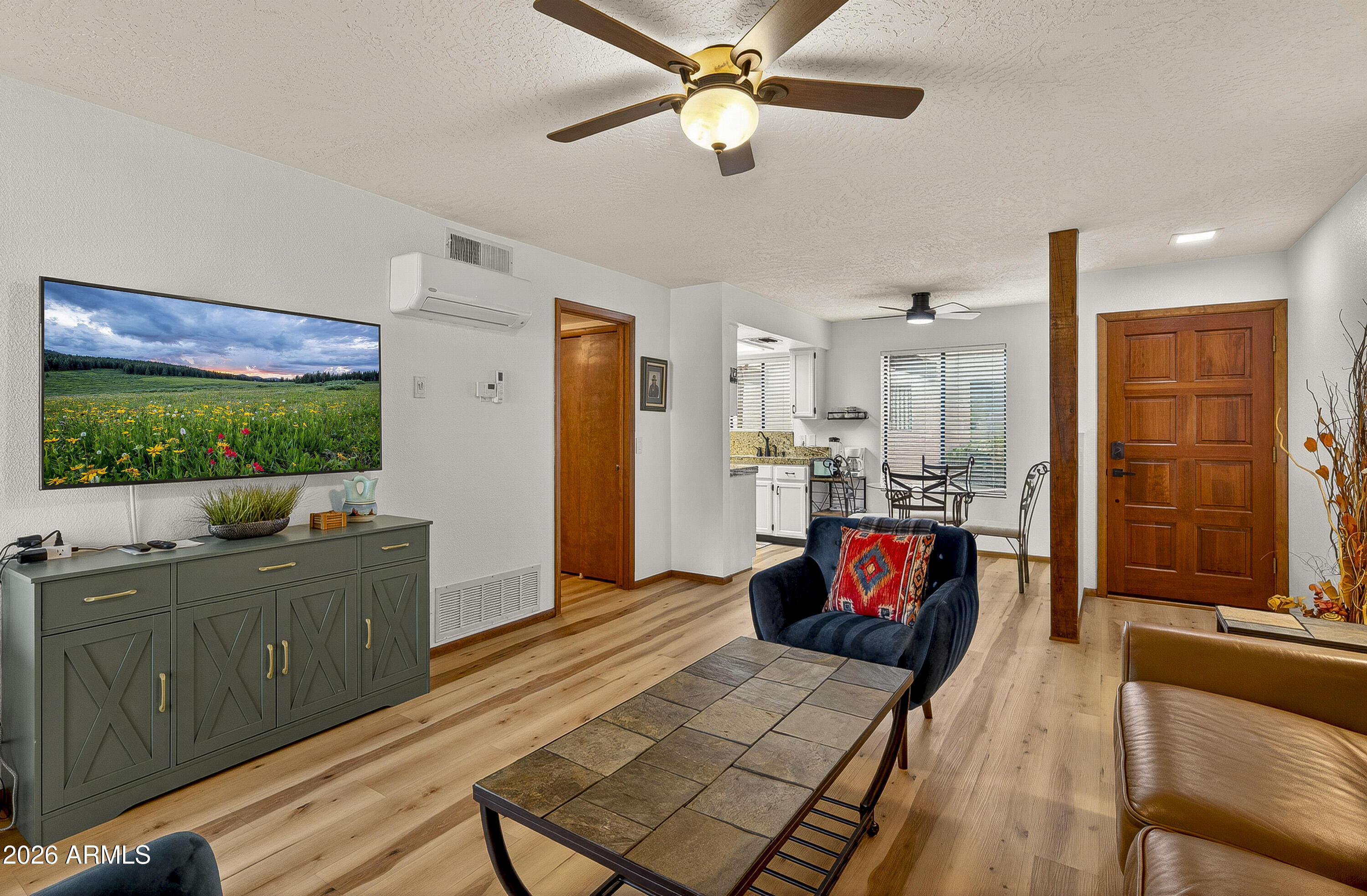 65 Verde Valley School Road, Unit E3 Sedona, AZ 86351 - Photo 8 of 24 a living room with furniture and a large window