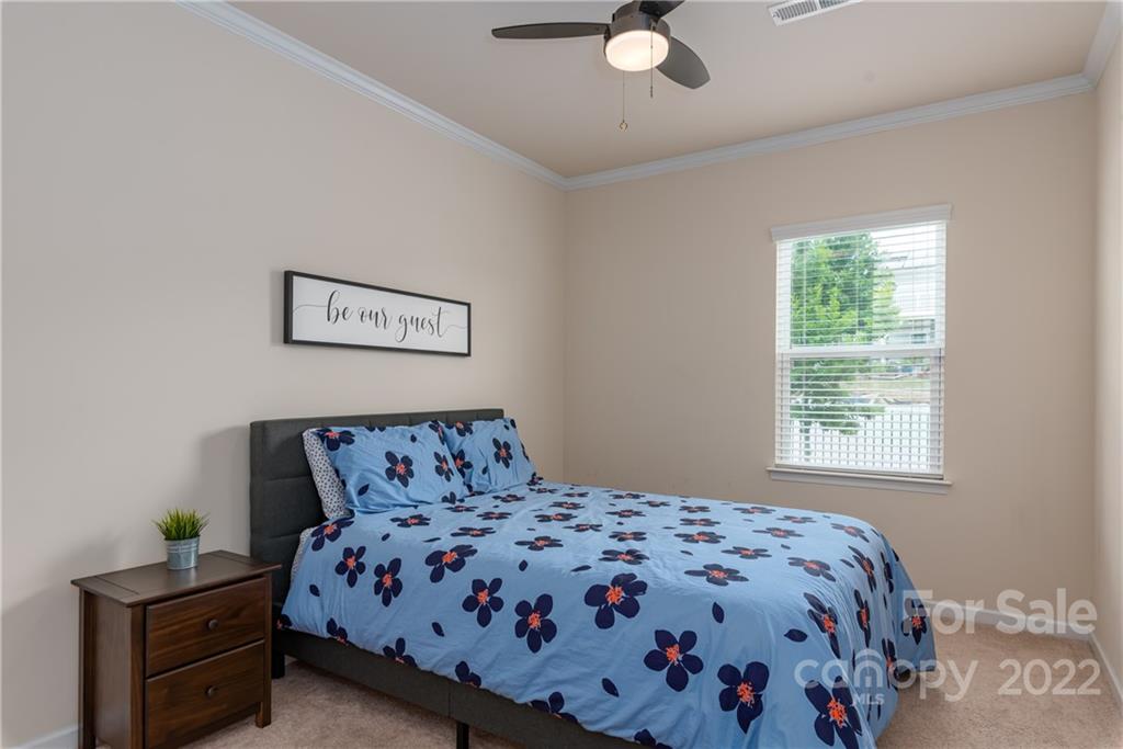 239 Keating Pl Drive Fort Mill, SC 29708 - Photo 16 of 33 a bedroom with a bed and a window