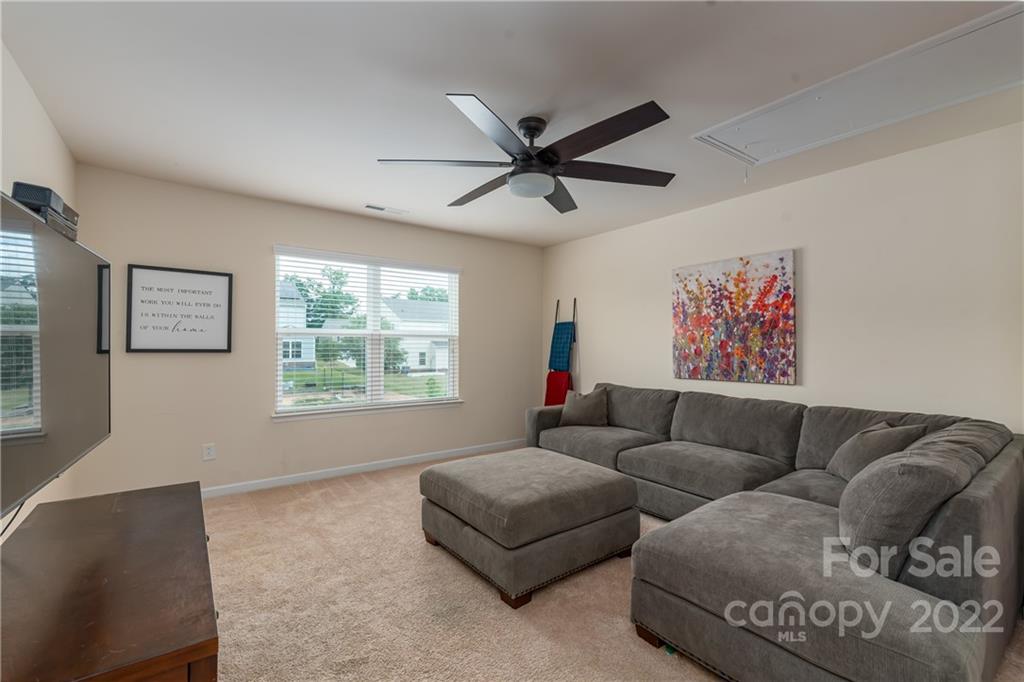 239 Keating Pl Drive Fort Mill, SC 29708 - Photo 18 of 33 a living room with furniture and a window