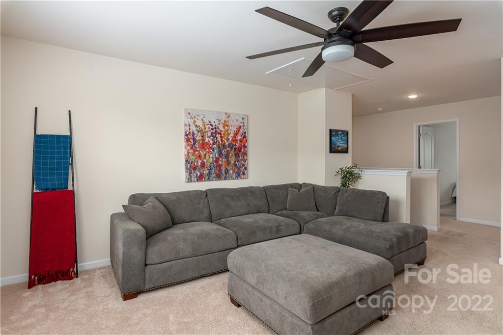 239 Keating Pl Drive Fort Mill, SC 29708 - Photo 19 of 33 a living room with furniture and a ceiling fan
