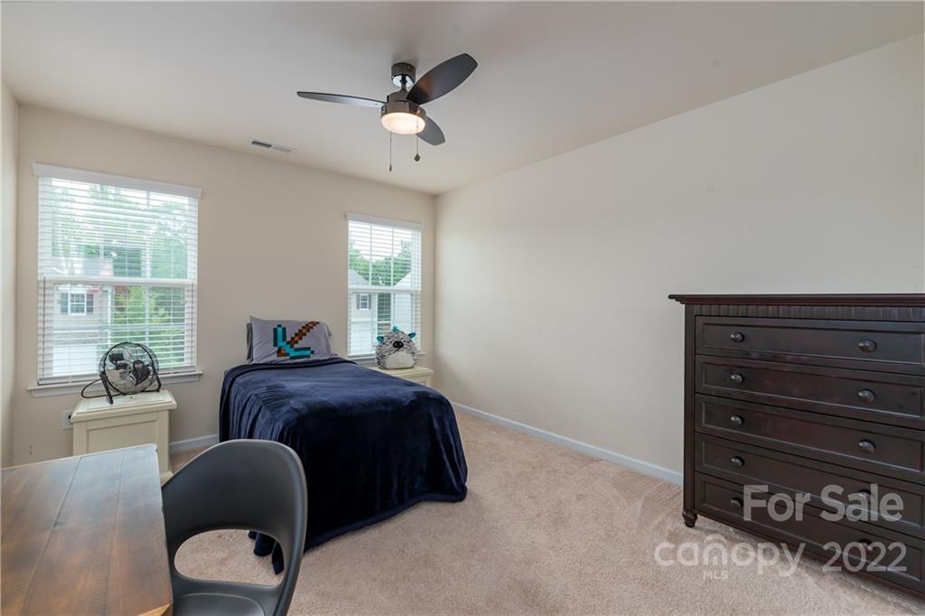239 Keating Pl Drive Fort Mill, SC 29708 - Photo 25 of 33 a bedroom with a bed and a window