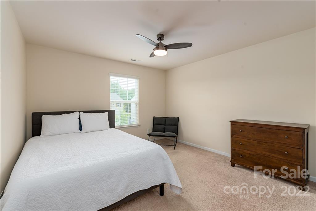 239 Keating Pl Drive Fort Mill, SC 29708 - Photo 26 of 33 a bedroom with a bed and a dresser