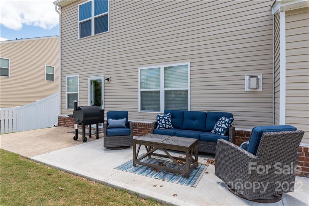 239 Keating Pl Drive Fort Mill, SC 29708 - Photo 29 of 33 a outdoor living space with furniture and a window