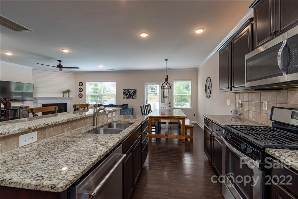 239 Keating Pl Drive Fort Mill, SC 29708 - Photo 10 of 33 a kitchen with lots of counter top space a sink and appliances