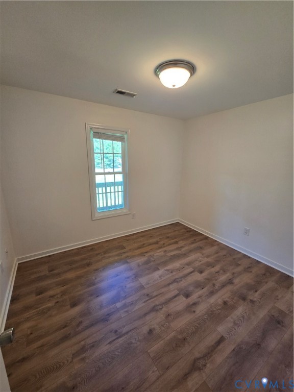 289 Winding Ridge Way Bumpass, VA 23024 - Photo 10 of 16 Wood-finish flooring, white walls, and a flush-mou