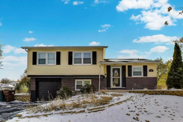 a front view of a house with yard