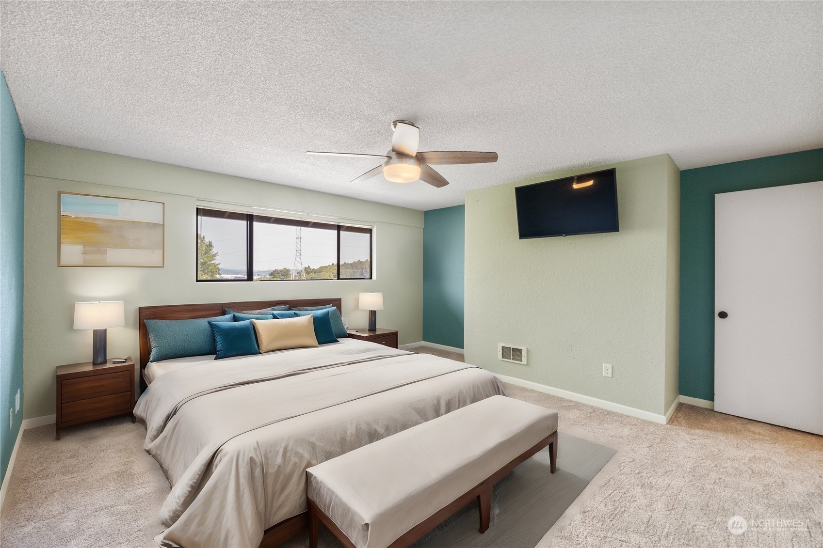 1633 Eagle Ridge Drive South, Unit A1 Renton, WA 98055 - Photo 7 of 35 a bedroom with a bed and a tv