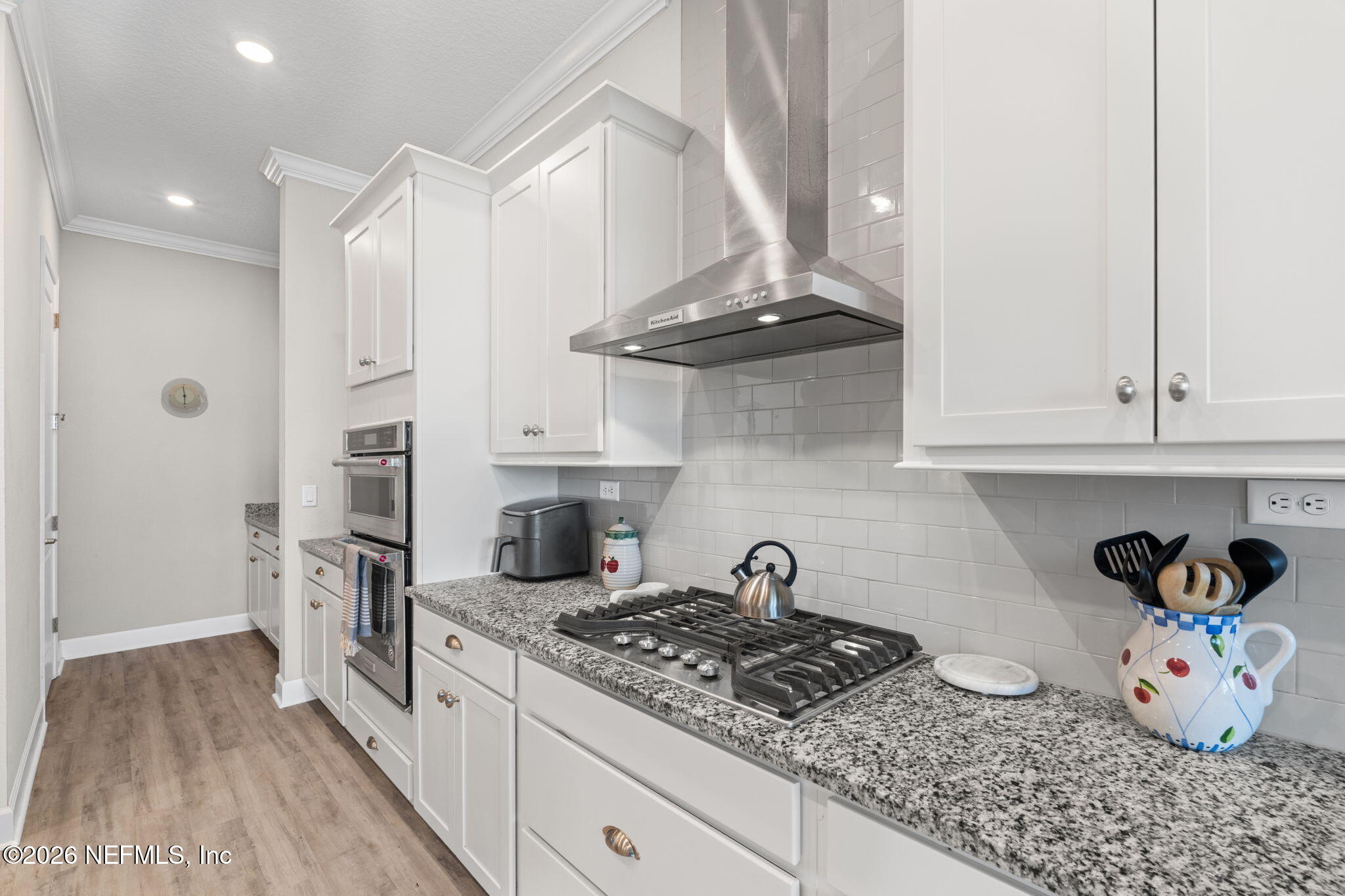 813 Rustic Mill Dr Street St. Augustine, FL 32092 - Photo 17 of 57 a kitchen with stainless steel appliances granite countertop a stove a sink and dishwasher